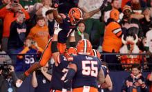 LeQuint Allen #1 of the Syracuse Orange celebrates with teammates after scoring a touchdown during the fourth quarter against the Miami Hurricanes at JMA Wireless Dome on November 30, 2024 in Syracuse, New York.