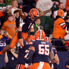 LeQuint Allen #1 of the Syracuse Orange celebrates with teammates after scoring a touchdown during the fourth quarter against the Miami Hurricanes at JMA Wireless Dome on November 30, 2024 in Syracuse, New York.