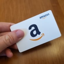 hand holding Amazon gift card