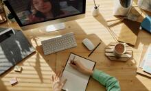 Note taking on desk from above