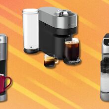 a keurig coffee maker, nespresso machine, and de'longhi espresso machine on an orange background