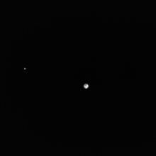 Earth and the moon as viewed by the European Space Agency's Hera mission. 