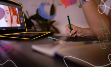 A person writing on a digital pad with a stylus. 