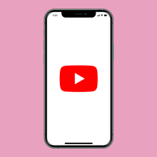 A phone screen with a YouTube logo on a pink background. 