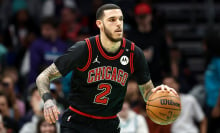  Lonzo Ball #2 of the Chicago Bulls dribbles during the first half of the game against the Charlotte Hornets at Spectrum Center on December 30, 2024 in Charlotte, North Carolina. 