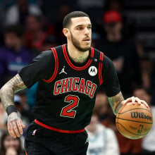  Lonzo Ball #2 of the Chicago Bulls dribbles during the first half of the game against the Charlotte Hornets at Spectrum Center on December 30, 2024 in Charlotte, North Carolina. 