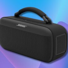 black bose soundlink max portable speaker on a purple and blue wavy background