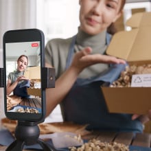 woman recording a video with smartphone