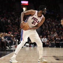  Joel Embiid #21 of the Philadelphia 76ers looks to pass away from Toumani Camara #33 of the Portland Trail Blazers during the third quarter at Moda Center on December 30, 2024 in Portland, Oregon. 