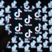 Tiktok logo is seen through a magnifier in Ankara, Turkiye on January 14, 2024.