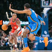 Kris Dunn #8 of the LA Clippers brings the ball up court against Jalen Williams #8 of the Oklahoma City Thunder during the second quarter at Paycom Center on January 2, 2025 in Oklahoma City, Oklahoma.