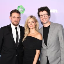 Samara Weaving, Matt Bettinelli-Olpin, and Tyler Gillett stand together on the red carpet.