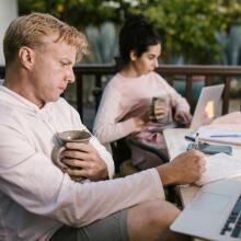 Couple looking at laptops