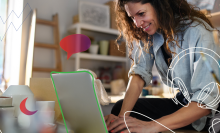 A woman using a laptop.