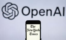 the New York Times logo is seen displayed on a mobile phone screen with OpenAI logo in the background.