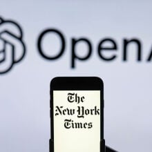 the New York Times logo is seen displayed on a mobile phone screen with OpenAI logo in the background.