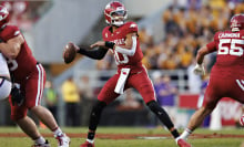 An Arkansas player attempts to throw the football.