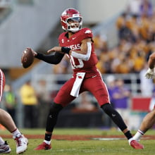 An Arkansas player attempts to throw the football.