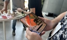 Man holding the Google Pixel 9 Pro Fold with both hands