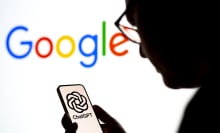 User looking at OpenAI ChatGPT logo on smartphone with Google logo in the background