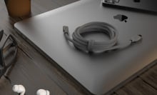 Flexi Pro charging cable on laptop with airpods