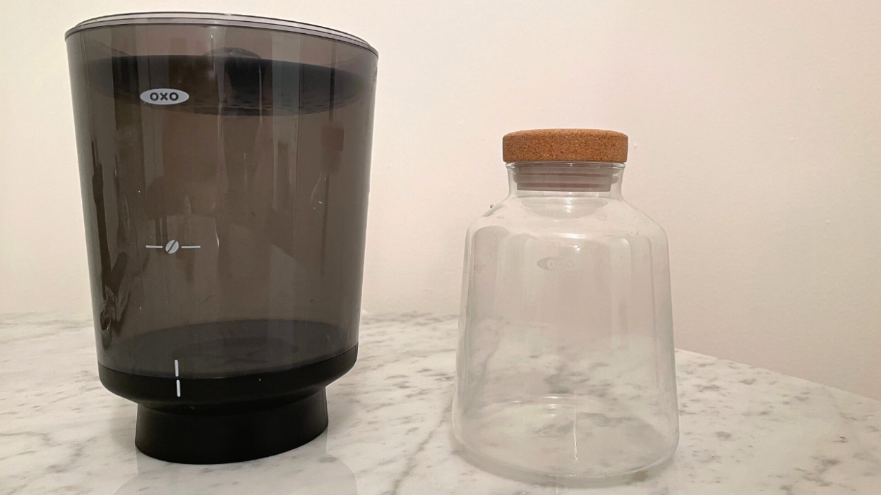 plastic brewing container next to glass carafe