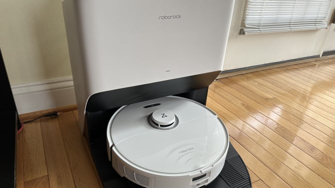 The Roborock S8 Pro Ultra in a white color, resting on its recharging base