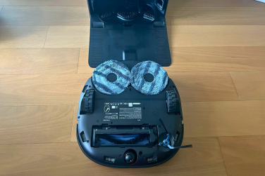 Eufy X10 Pro Omni robot vacuum flipped over to see mopping pads and roller brush underneath