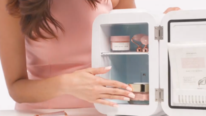 woman opening beauty fridge