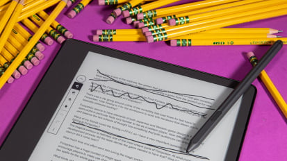 kindle scribe surrounded by pencils