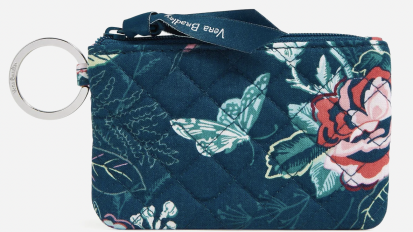 The Zip ID Case wallet from Vera Bradley with a darkish floral and butterfly print