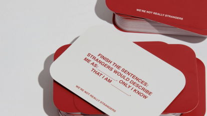 The WNRS card deck in white and red colors with thoughtful prompts on the cards