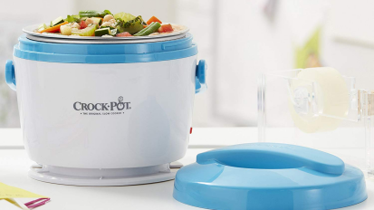 Blue and white crock pot with veggies inside