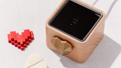 wooden box with red heart-shaped piece and white smooth heart next to it