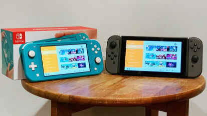 two nintendo switch lite consoles on stool