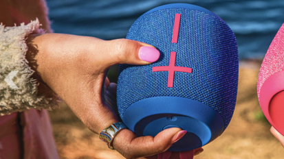 woman holding wonderboom 3 portable speaker