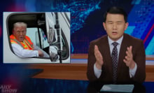 A man sits behind a talk show desk looking confused. In the top-left is an image of a man in hi-vis in a garbage truck.