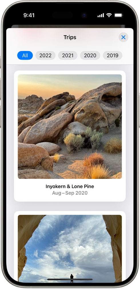 Trips is open in the Photos app. A row of years appears along the top of the screen. All is selected, and below it are collections of photos, each from a different trip.