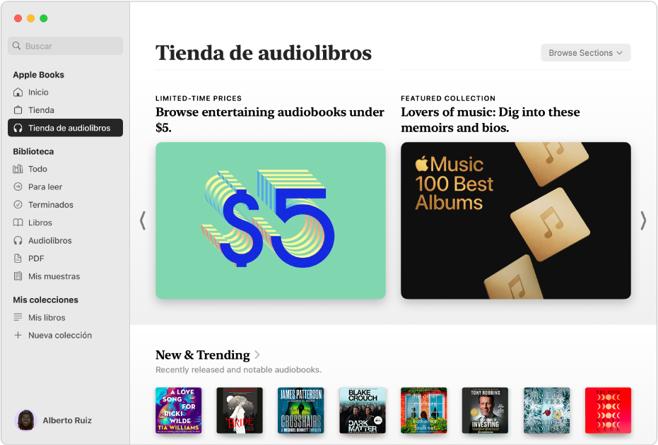 Una ventana de la app Libros, con la tienda de audiolibros seleccionada en la barra lateral y categorías de títulos a la derecha, que incluyen “Novedades y tendencias” y “Audiolibros en descuento”.