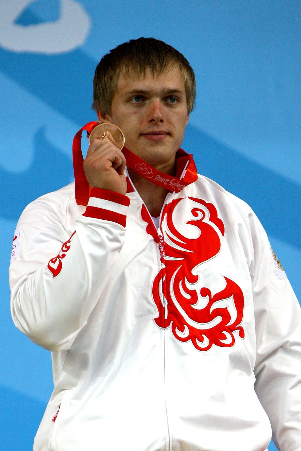 Medal, Outerwear, Gesture, Gold medal, 