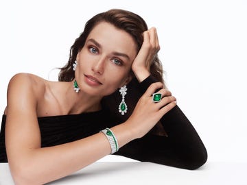 model showcasing elegant jewelry with emerald accents