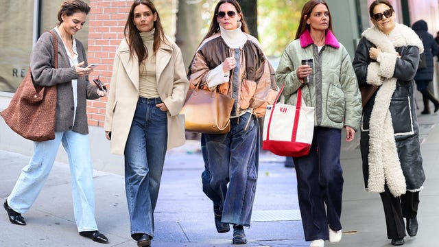 group of women walking on a city street wearing various winter outfits