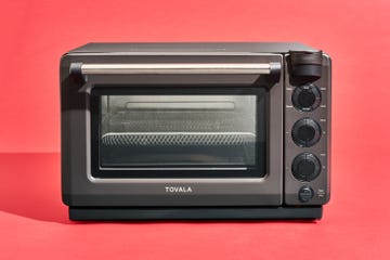 a small oven with a black knob