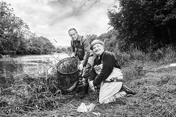 paul whitehouse and bob mortimer pose with a fishing net by a river bbc tv show gone fishing