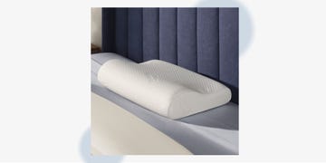 memory foam pillow designed for ergonomic support on a bed