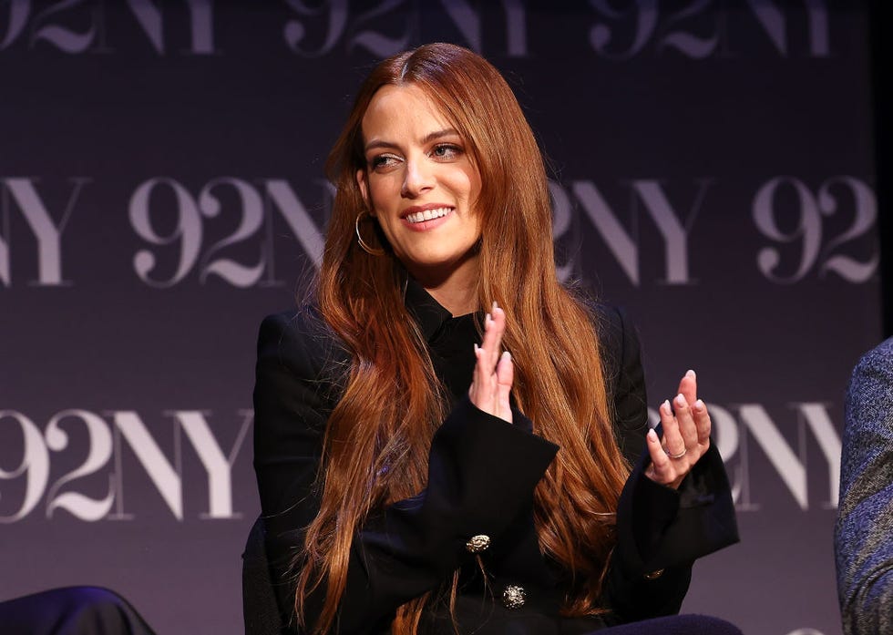 riley keough clapping her hands during a panel conversation