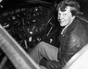 amelia earhart in the cockpit of an airplane