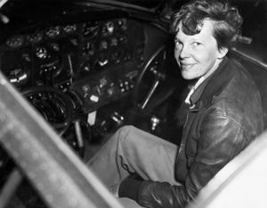 amelia earhart in the cockpit of an airplane