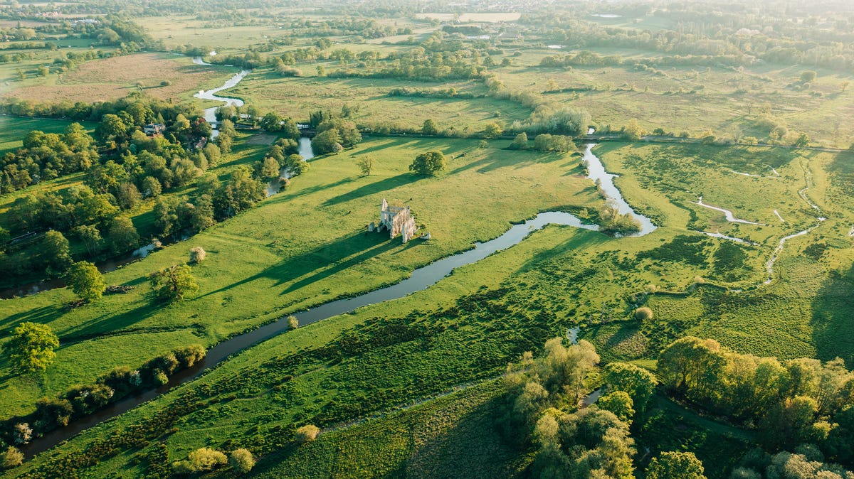 an aerial sunset view of the newark priory ruins, surrey stock photo