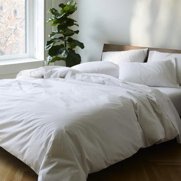 a bed with white sheets